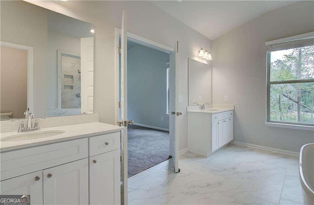 160 Cooper Cv W Lot 64, Fayetteville, GA 30215 - bathroom featuring two vanities, a shower stall, marble finish flooring, and a soaking tub