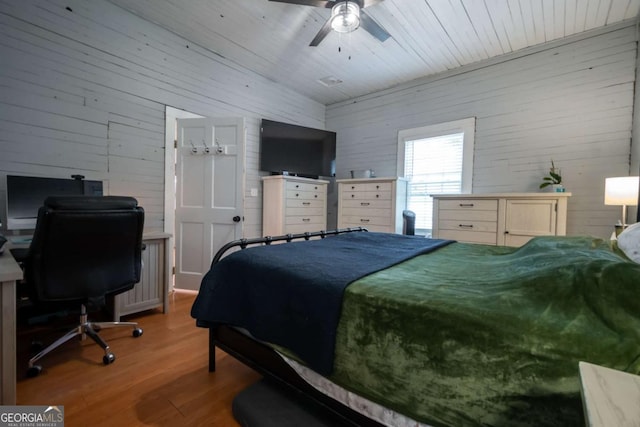 180 Cross St, Maysville, GA 30558 - bedroom featuring wooden walls, wood finished floors, a desk, wooden ceiling, and ceiling fan