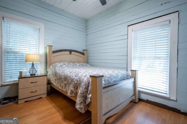 180 Cross St, Maysville, GA 30558 - bedroom with wood finished floors, wooden walls, a ceiling fan, and wooden ceiling