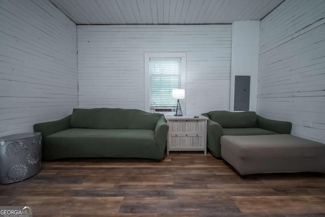 180 Cross St, Maysville, GA 30558 - living area featuring electric panel, dark wood-style flooring, and wood walls