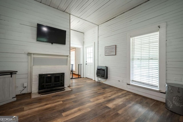 180 Cross St, Maysville, GA 30558 - unfurnished living room featuring heating unit, wood finished floors, and wooden walls