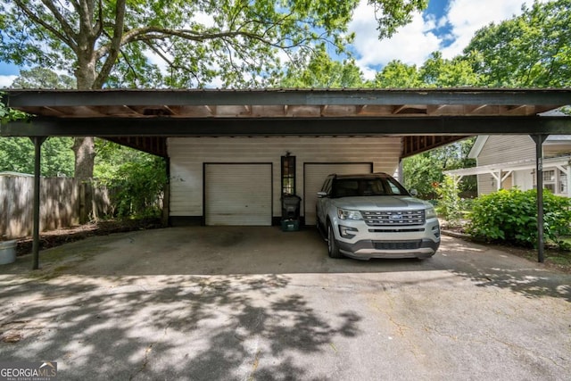 180 Cross St, Maysville, GA 30558 - view of parking / parking lot featuring a detached garage and fence