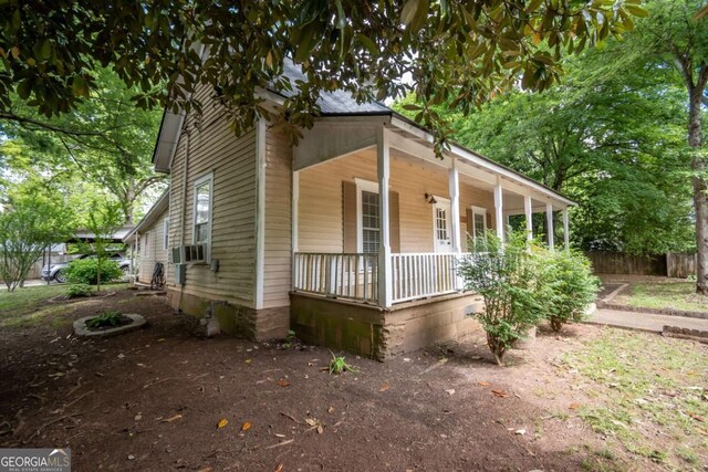 180 Cross St, Maysville, GA 30558 - view of front of home with covered porch and fence