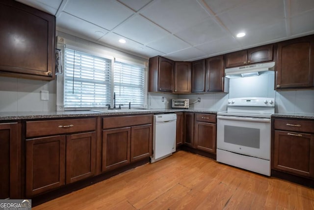 180 Cross St, Maysville, GA 30558 - kitchen featuring white appliances, under cabinet range hood, a sink, light wood-style floors, and stone counters