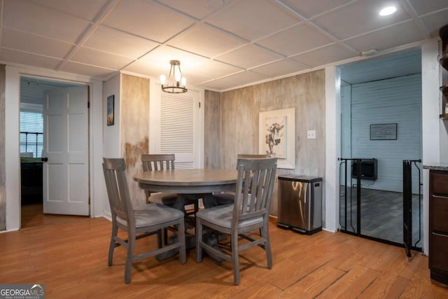 180 Cross St, Maysville, GA 30558 - dining space featuring light wood-type flooring, a chandelier, and a drop ceiling