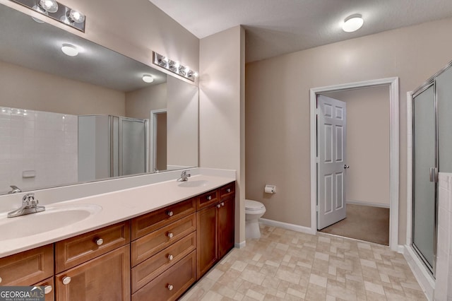 3500 Sweetwater Rd Unit 522, Duluth, GA 30096 - full bath with a stall shower, double vanity, baseboards, and toilet