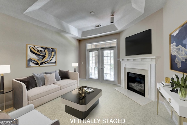 3500 Sweetwater Rd Unit 522, Duluth, GA 30096 - living room with a raised ceiling, a premium fireplace, and carpet