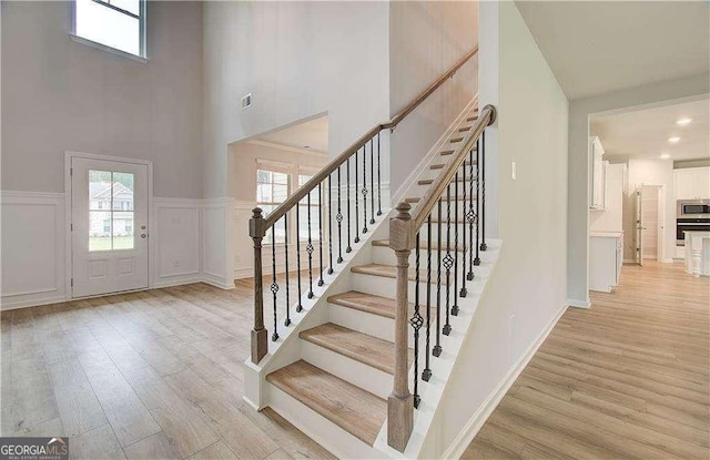 125 Cooper Cv W Lot 72, Fayetteville, GA 30215 - entryway featuring light wood-type flooring, a high ceiling, and stairway