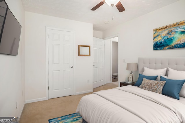 807 Ideal Pl, Winder, GA 30680 - bedroom with light colored carpet, baseboards, and ceiling fan