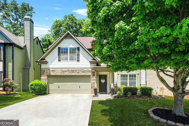 1326 Castleberry Dr, Buford, GA 30518 - view of front of house with driveway, a garage, stone siding, and a front lawn