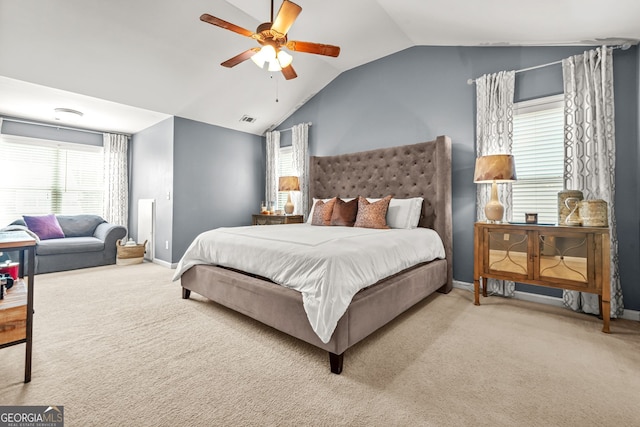 1326 Castleberry Dr, Buford, GA 30518 - carpeted bedroom featuring lofted ceiling, baseboards, multiple windows, and a ceiling fan
