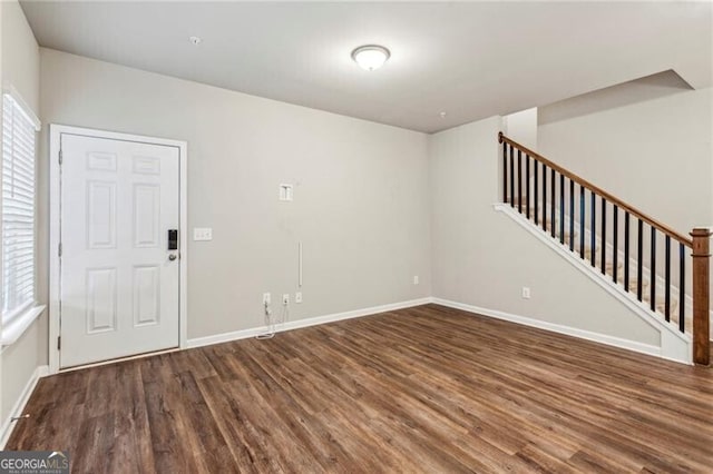 2111 Wesson Ct, Kennesaw, GA 30144 - unfurnished living room featuring wood finished floors, stairs, and baseboards