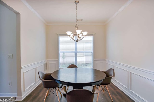 5730 Weddington Dr, Cumming, GA 30040 - dining area with dark wood-style floors, a chandelier, ornamental molding, a wainscoted wall, and a decorative wall