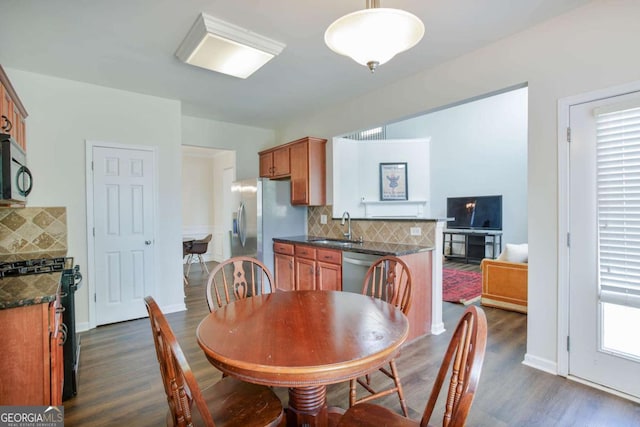 5730 Weddington Dr, Cumming, GA 30040 - dining room featuring dark wood-style flooring and a fireplace