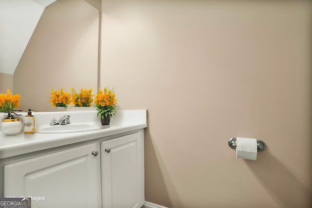 132 Tara Commons Dr, Loganville, GA 30052 - bathroom featuring vanity and vaulted ceiling
