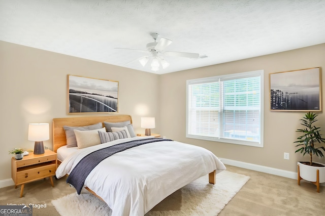 132 Tara Commons Dr, Loganville, GA 30052 - bedroom featuring baseboards, carpet, and a ceiling fan