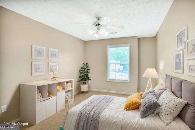 132 Tara Commons Dr, Loganville, GA 30052 - bedroom featuring light colored carpet, baseboards, and a ceiling fan