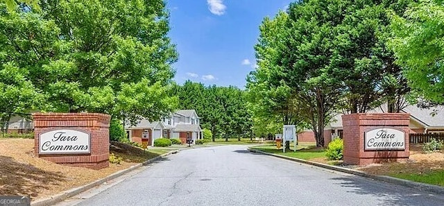 132 Tara Commons Dr, Loganville, GA 30052 - view of asphalt road with curbs