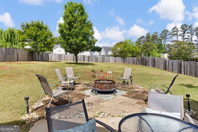 102 Autumn Brooke Trl, Dallas, GA 30157 - fenced backyard with a patio and an outdoor fire pit