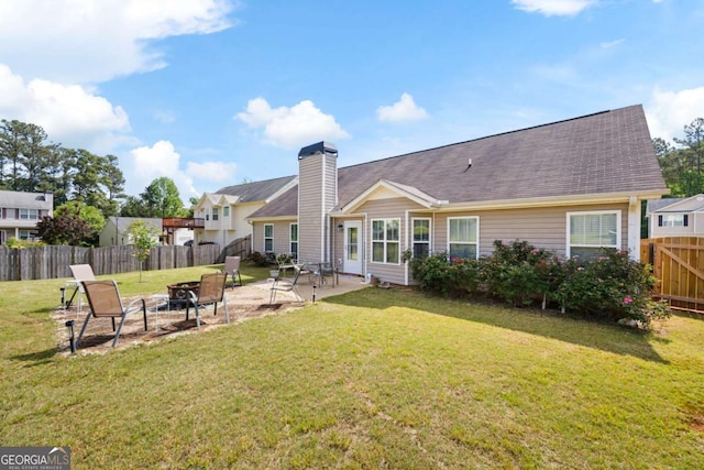 102 Autumn Brooke Trl, Dallas, GA 30157 - rear view of house featuring a fenced backyard, a patio area, an outdoor fire pit, a chimney, and roof with shingles