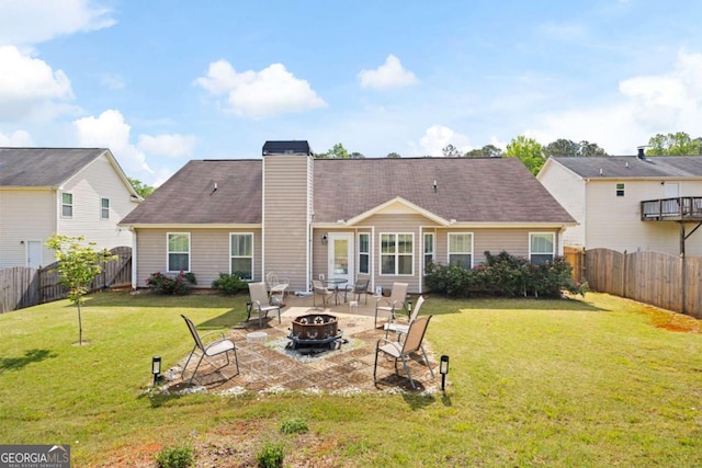102 Autumn Brooke Trl, Dallas, GA 30157 - rear view of property featuring a fire pit, a fenced backyard, a chimney, and a patio area