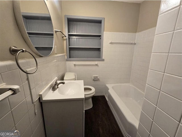 767 Vinson Pl SW, Atlanta, GA 30315 - full bath with tile walls, toilet, vanity, and a wainscoted wall