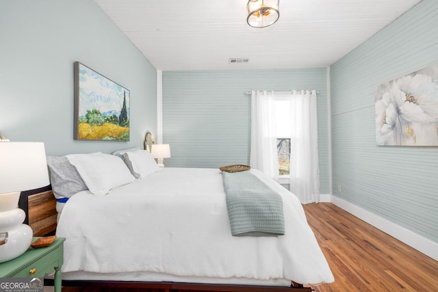 11 Pine St, Covington, GA 30014 - bedroom featuring baseboards and wood finished floors