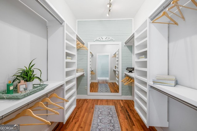 11 Pine St, Covington, GA 30014 - spacious closet featuring wood finished floors