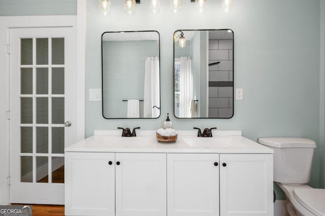 11 Pine St, Covington, GA 30014 - bathroom with toilet and double vanity