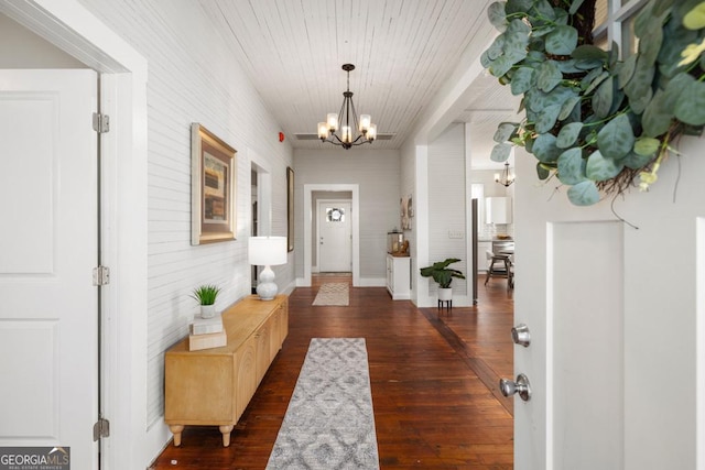 11 Pine St, Covington, GA 30014 - doorway with a chandelier and dark wood-type flooring