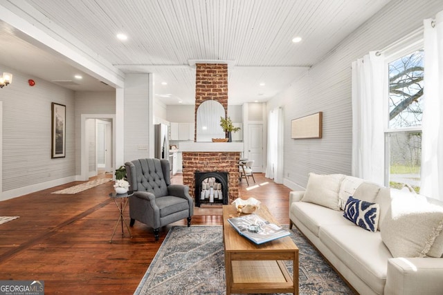 11 Pine St, Covington, GA 30014 - living room with a fireplace, wood finished floors, baseboards, and recessed lighting