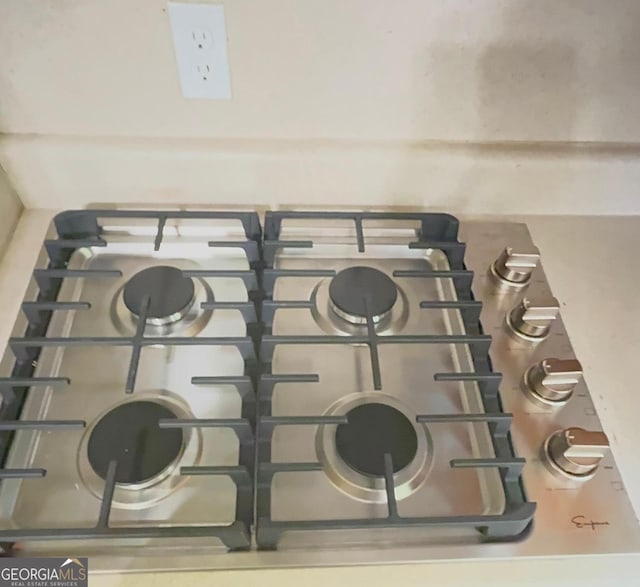 kitchen view of stainless steel gas cooktop
