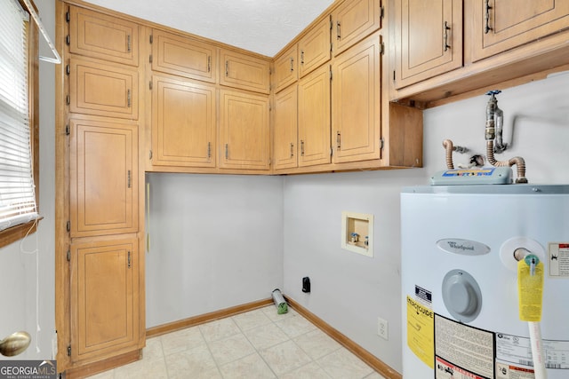 95 Stephens Dr, Covington, GA 30016 - laundry room featuring water heater, cabinet space, baseboards, and hookup for a washing machine