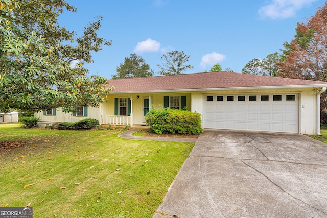 95 Stephens Dr, Covington, GA 30016 - ranch-style house featuring an attached garage, concrete driveway, a porch, and a front yard