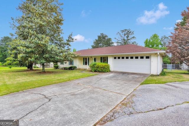 95 Stephens Dr, Covington, GA 30016 - ranch-style house with a garage and driveway