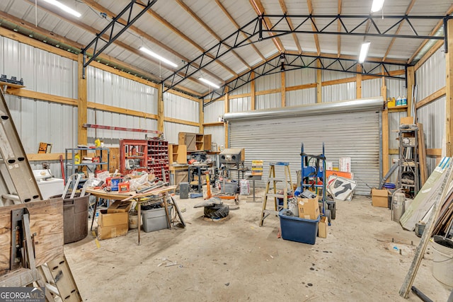 95 Stephens Dr, Covington, GA 30016 - garage with metal wall and a workshop area