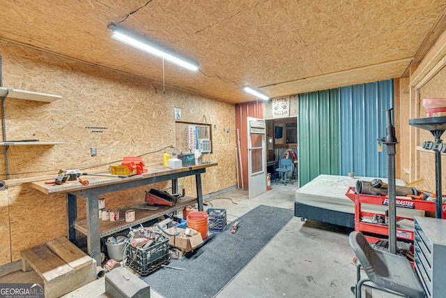 95 Stephens Dr, Covington, GA 30016 - miscellaneous room with a workshop area and concrete flooring