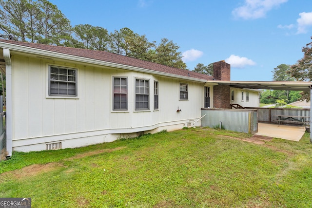 95 Stephens Dr, Covington, GA 30016 - back of property featuring a chimney, crawl space, and a patio
