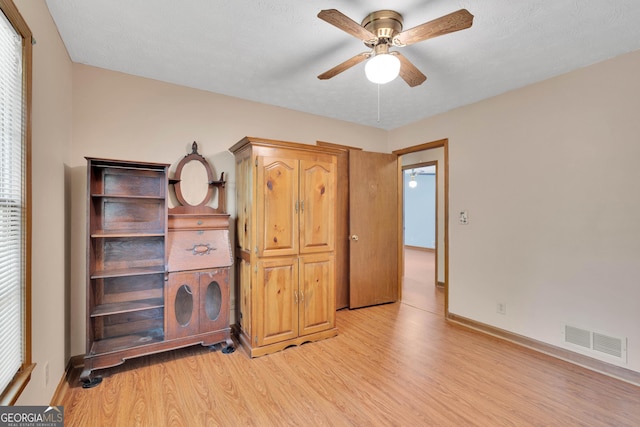95 Stephens Dr, Covington, GA 30016 - bedroom with light wood finished floors, baseboards, and ceiling fan