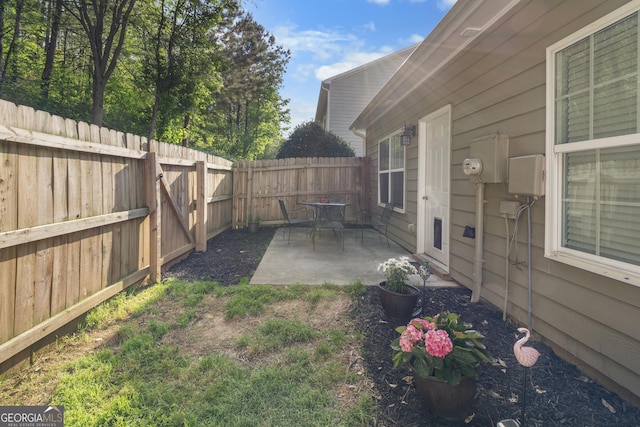 fenced backyard featuring a patio area
