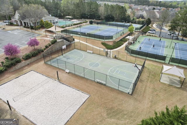 view of basketball court featuring fence and community basketball court