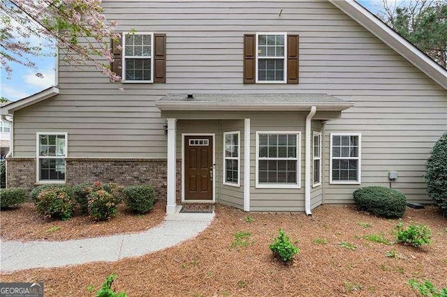 view of front of property featuring brick siding