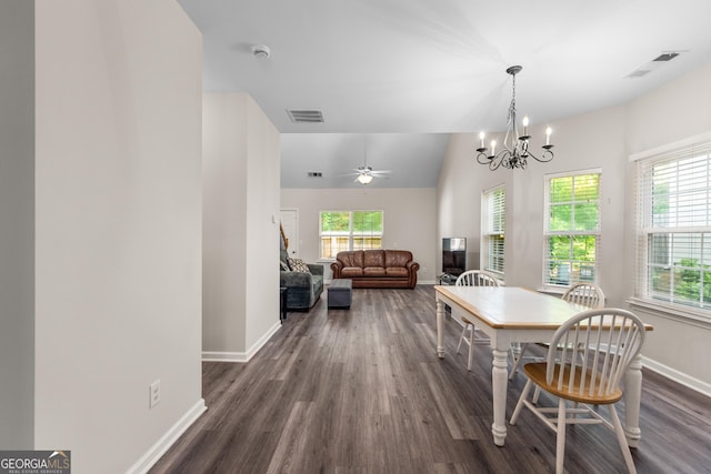 dining room featuring baseboards, dark wood finished floors, a chandelier, lofted ceiling, and ceiling fan