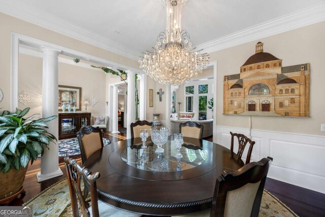 3182 Deepwater Dr, Gainesville, GA 30506 - dining room featuring decorative columns, ornamental molding, wood finished floors, wainscoting, and a chandelier