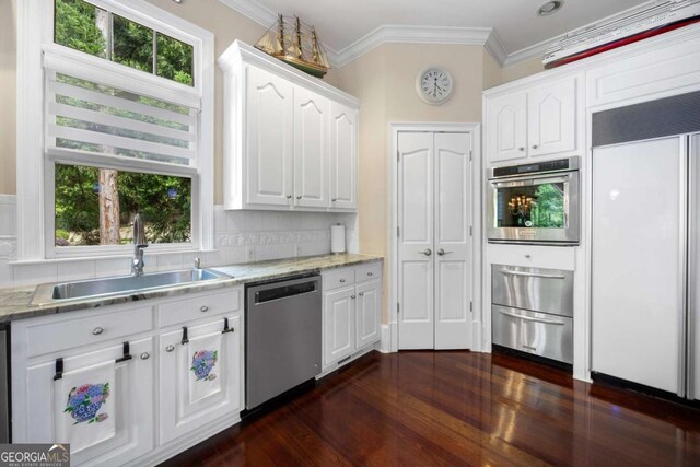 3182 Deepwater Dr, Gainesville, GA 30506 - kitchen with appliances with stainless steel finishes, a sink, ornamental molding, a warming drawer, and white cabinets