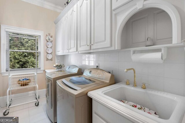 3182 Deepwater Dr, Gainesville, GA 30506 - washroom featuring washer and dryer, cabinet space, ornamental molding, and light tile patterned flooring