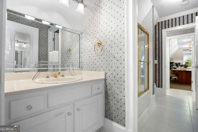 3182 Deepwater Dr, Gainesville, GA 30506 - bathroom with wallpapered walls, vaulted ceiling, vanity, tile patterned flooring, and baseboards