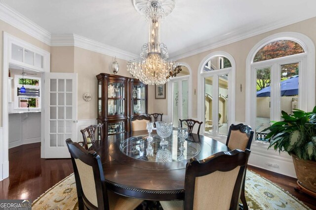3182 Deepwater Dr, Gainesville, GA 30506 - dining room featuring french doors, crown molding, wood finished floors, a chandelier, and wainscoting