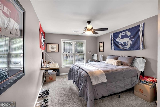 bedroom featuring carpet, baseboards, and a ceiling fan