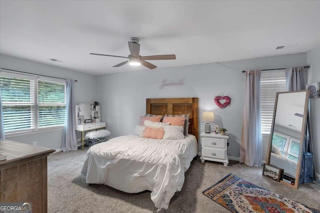 bedroom with carpet floors, ceiling fan, and baseboards